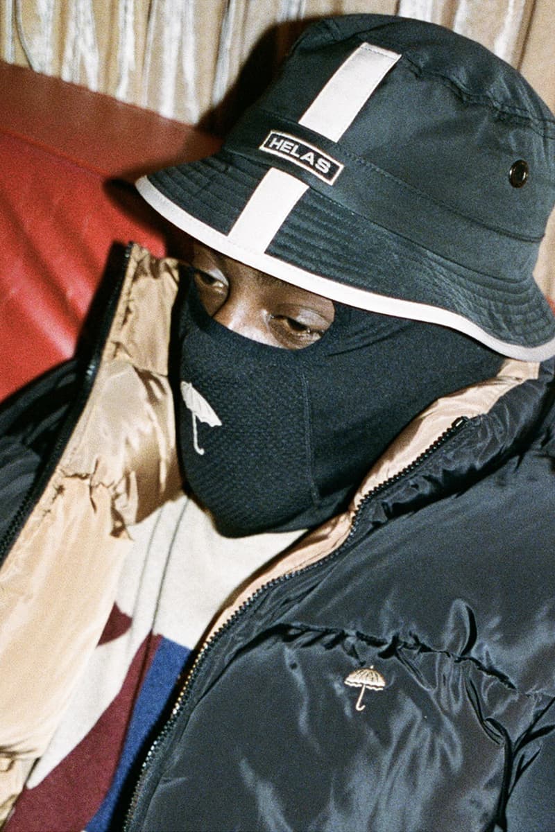 Hélas Takes You on a Holiday Cabin Getaway for Winter 2023 lookbook release info post-athleisure cabin vibes old world chateau surrounding forests balaclava earthy tones 